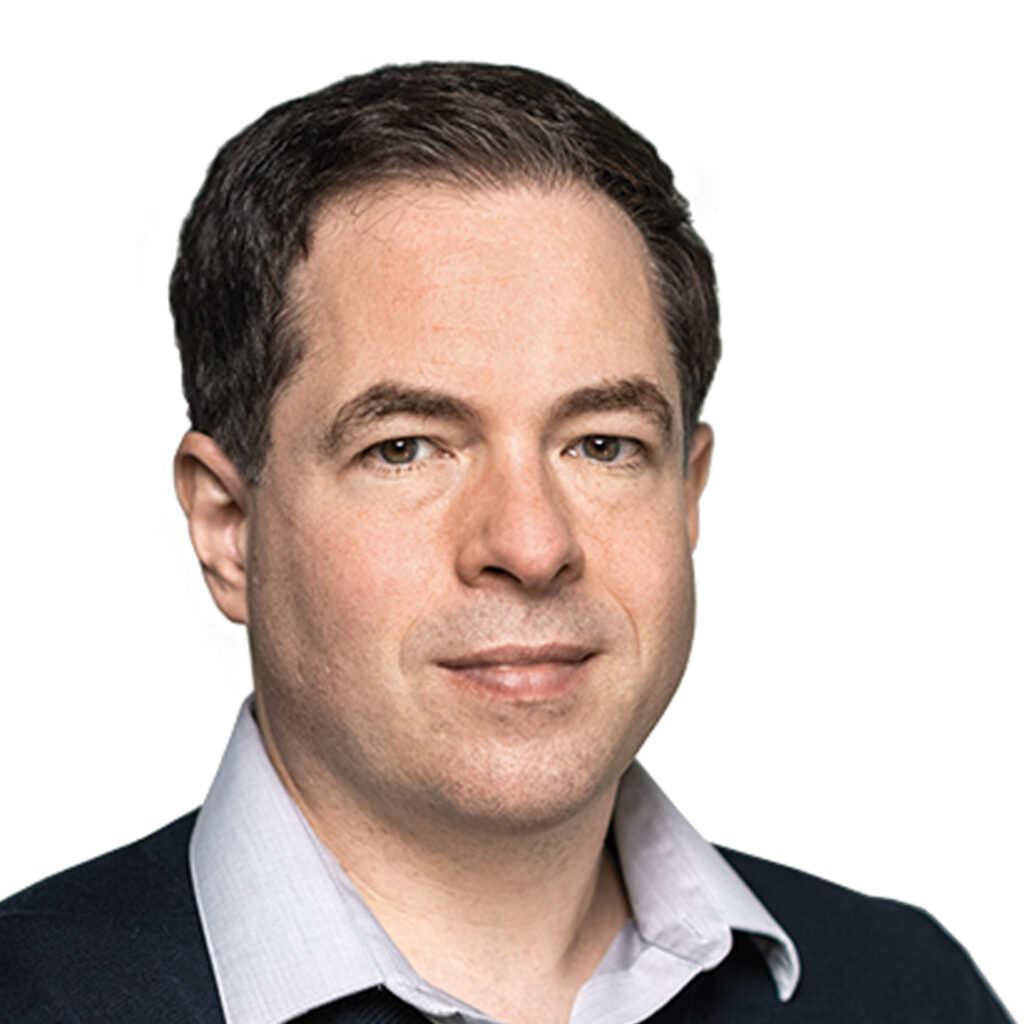 Headshot of Professor Robert Perneczky smiling, with a simple white background